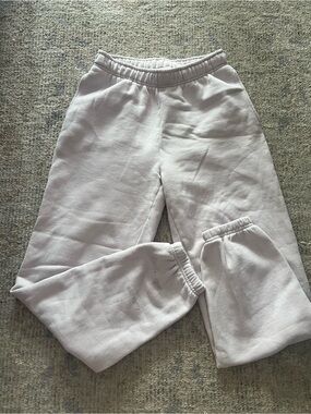 aritzia boyfriend sweats in a soft pink